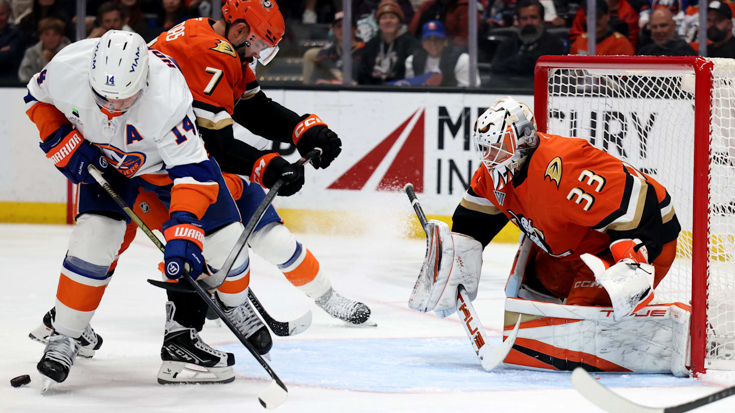 Mar 4, 2026; Anaheim, California, USA;  Anaheim Ducks goaltender Ville Husso (33) defends the goal as New York Islanders center Bo Horvat (14) and Anaheim Ducks defenseman Radko Gudas (7) fight for the puck during the third period at Honda Center. Mandatory Credit: Kiyoshi Mio-Imagn Images