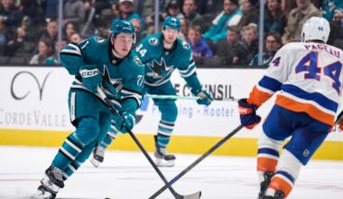 Mar 8, 2025; San Jose, California, USA; San Jose Sharks center Macklin Celebrini (71) plays the puck against New York Islanders center Jean-Gabriel Pageau (44) during the second period at SAP Center at San Jose. Mandatory Credit: Robert Edwards-Imagn Images