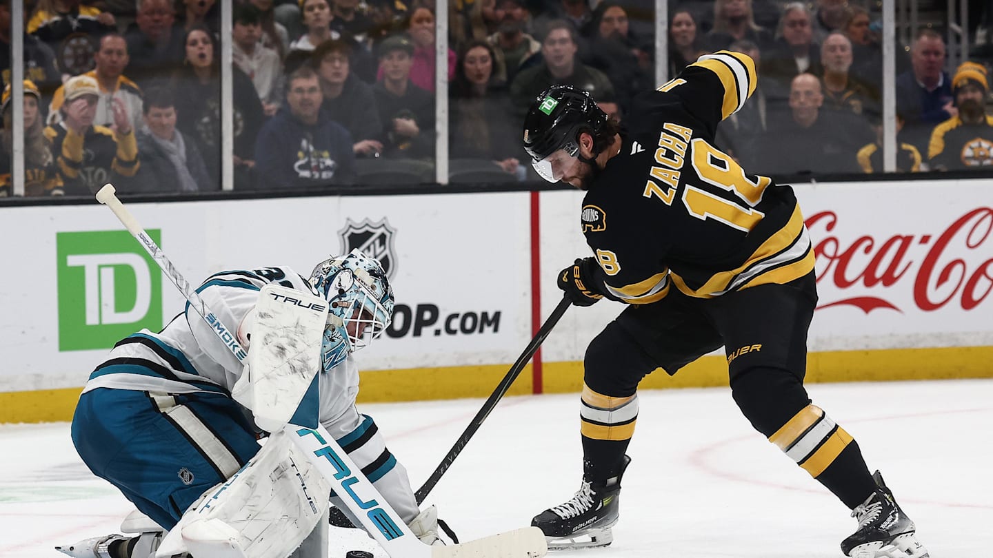 Mar 12, 2026; Boston, Massachusetts, USA; Boston Bruins center Pavel Zacha (18) tries to get to a rebound in front of San Jose Sharks goaltender Alex Nedeljkovic (33) during the second period at TD Garden. Mandatory Credit: Winslow Townson-Imagn Images