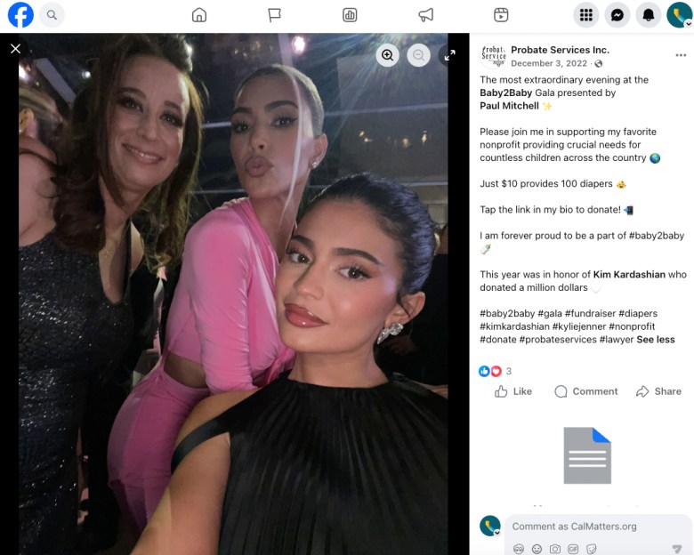 Three people pose for a selfie at a formal evening event, with dim lighting and stage lights visible in the background.