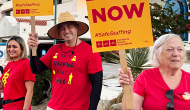 Tenet nurses holding signs and shirt "Safe staffing now" "Safe staffing saves lives"