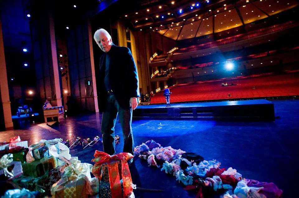 Artistic Director Ron Cunningham makes some adjustments to props during a dress rehearsal of  "Nutcracker" at the Community Center Theater in Sacramento in 2008.