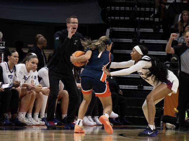 Texas Christian University Horned Frogs head coach Mark Campbell yells at his defense in the first half against the Virginia Cavaliers in an NCAA Women’s Basketball Tournament Sweet 16 game Saturday at Golden 1 Center in Sacramento.