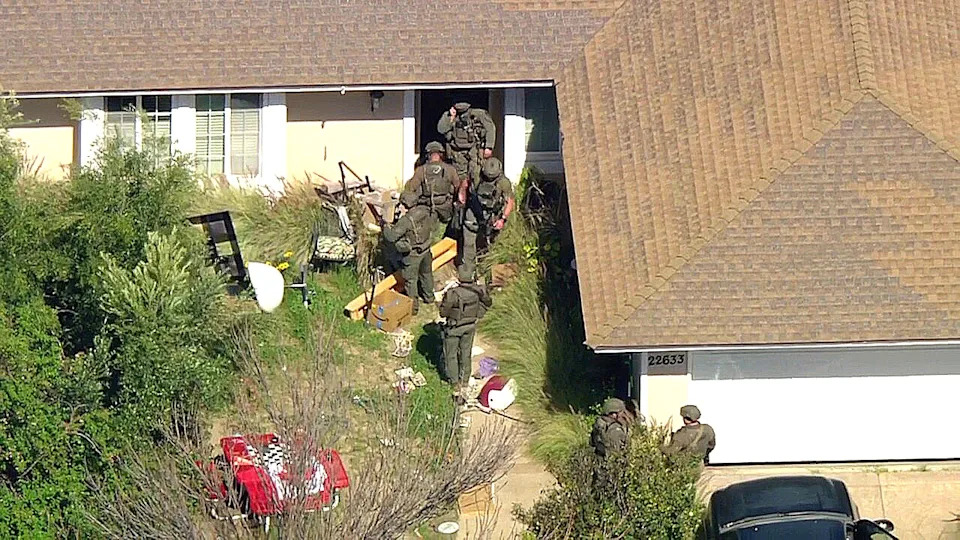 SWAT crews enter home