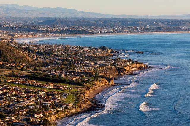 Waves roll in along the bluffs in Shell Beach.