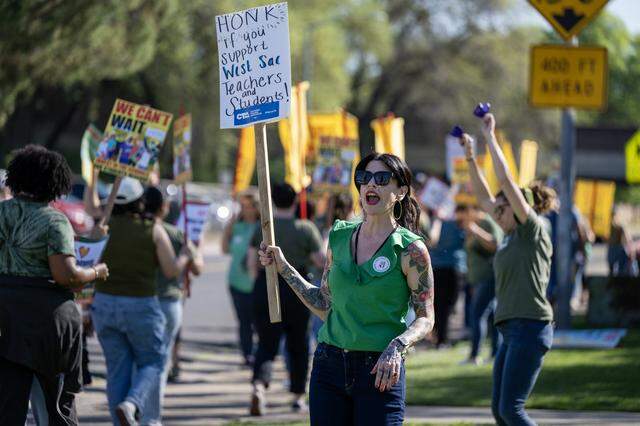 Teachers and supporters picket outside the Washington Unified School District in West Sacramento on Tuesday.