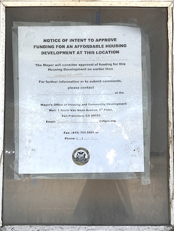 A public notice taped to a window. 