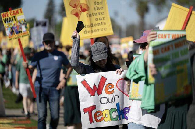 Teachers and supporters picket outside the Washington Unified School District office in West Sacramento on Tuesday.