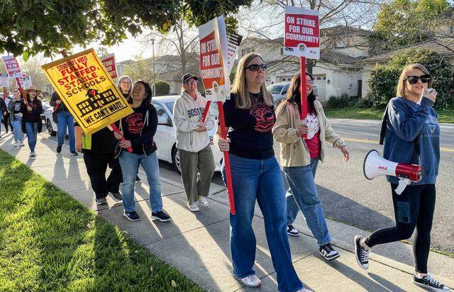 Teachers picket at Heron School in North Natomas on Tuesday.