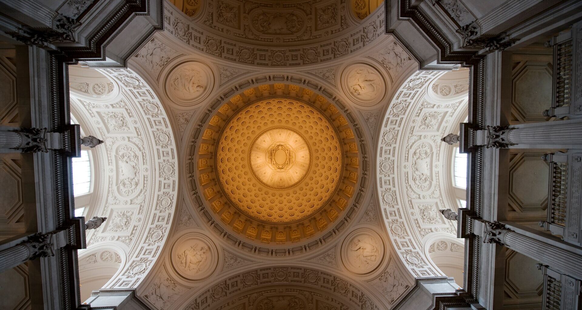 Dome ceiling with mosaic tiles at a court house in california.