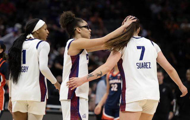 Texas Christian University Horned Frogs guard Olivia Miles (5) and forward Marta Suárez (7) come together as the Virginia Cavaliers called a timeout in the second half of the NCAA Women’s Basketball Tournament Sweet 16 on Saturday, March 28, 2026 at Golden 1 Center.