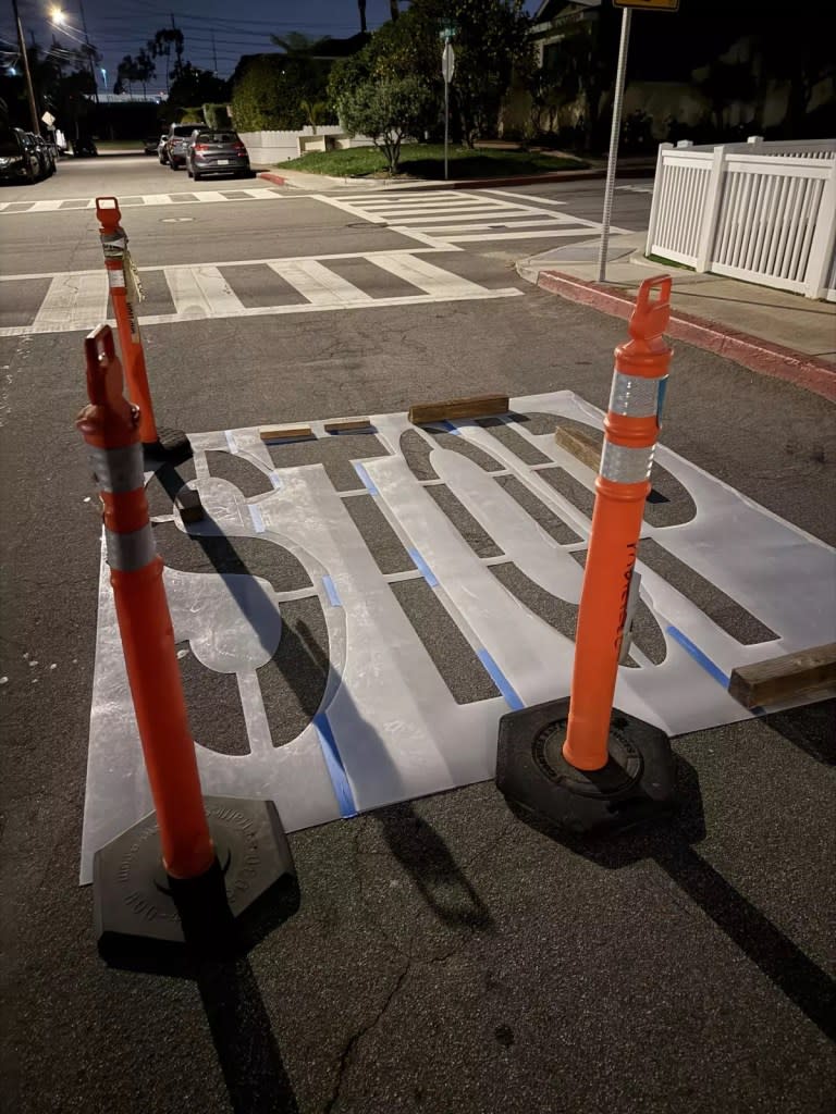 He painted the word “Stop” on the ground. Joseph Brandlin