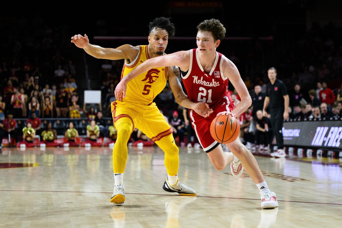 Nebraska forward Pryce Sandfort, right, drive past USC forward Terrance Williams II, left, in the first half Saturday.
