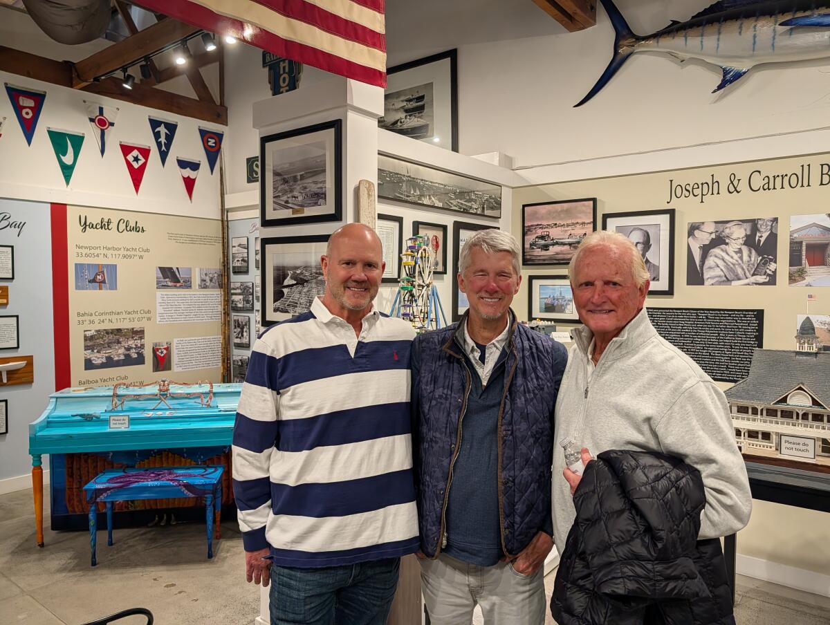 Bill Lobdell, from left, John Conners and Doug Hanes pose togther at the Balboa Island Museum.