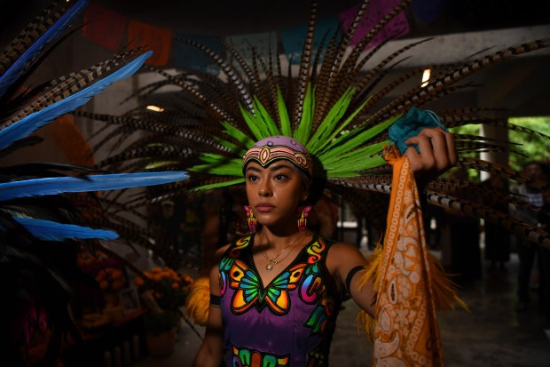Liliana Bernardo with the Ollin Anahuac Traditional Aztec Dance Group performs a dance during the 29th annual Dia De Los Muertos Celebration at the Oakland Museum of California in Oakland, Calif., on Sunday, Oct. 22, 2023. Because of the weather many of the performances that were planned outside were moved inside. (Jose Carlos Fajardo/Bay Area News Group)