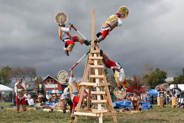 Members from the Huahuas, from Papantla, Veracruz perform the Cruzeta at the 25th Annual Mexica New Year, hosted by Calpulli Tonalehqueh, Azteca Dancers of East San Jose. Over 500 indigenous Danza from across the United States and Mexico participated at Emma Prusch Park in San Jose, Calif., on Saturday, March 11, 2022. The three day ceremony will continue on Sunday, March12, from 9am-5pm at Emma Prusch Park. (Josie Lepe for Bay Area News Group)