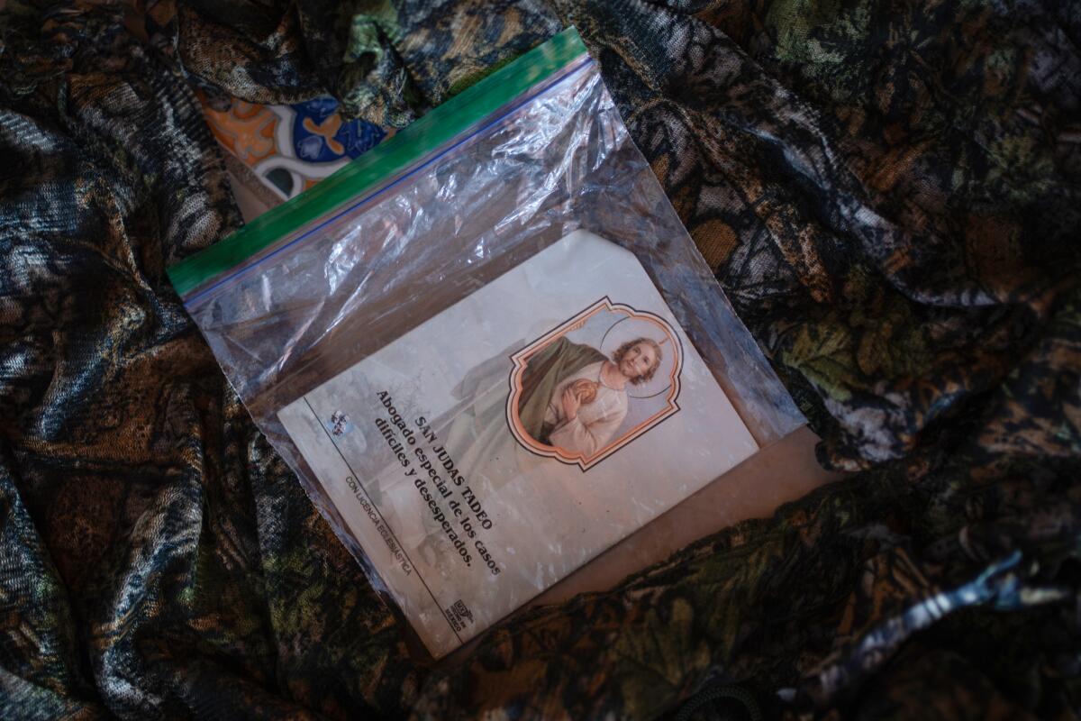 An image of the Catholic saint San Judas Tadeo is seen inside a transparent plastic bag