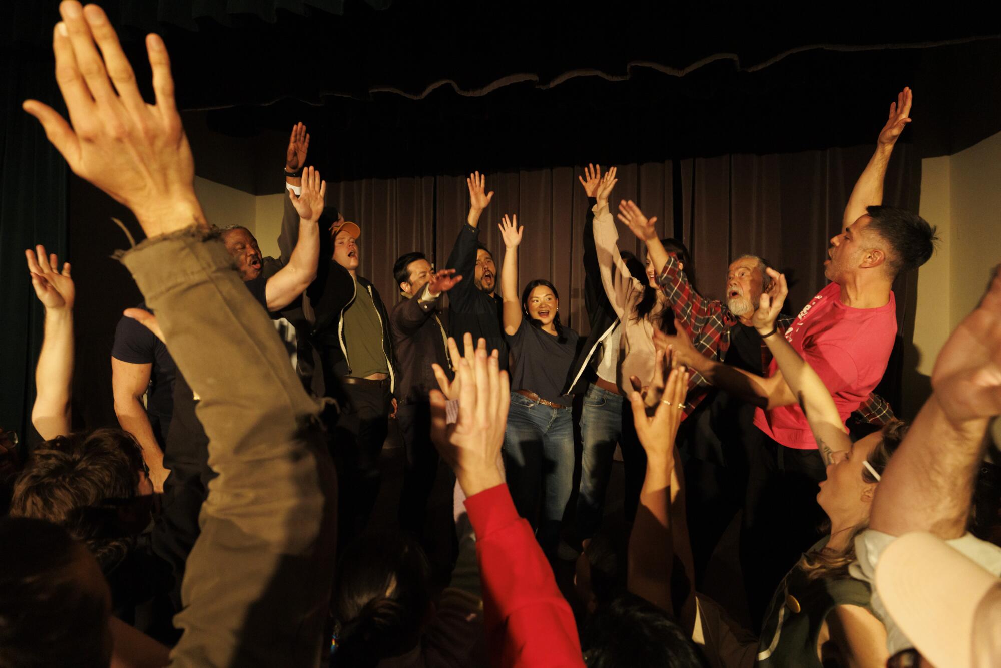 Performers cheer before a show.