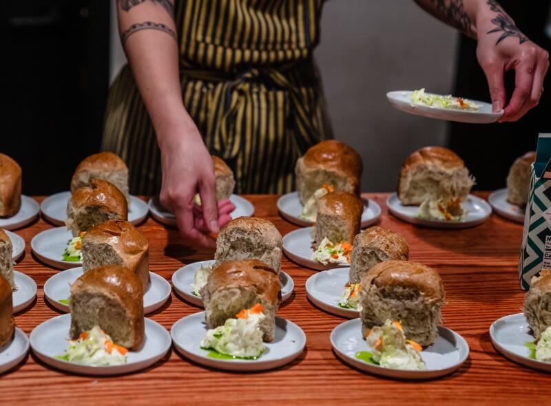 Small plates with buckwheat brioche and whipped herb butter.