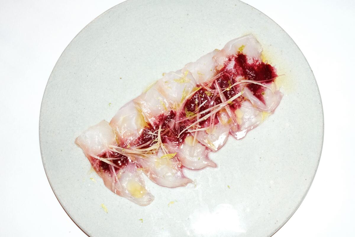 Slices of raw fish with plum and citrus at Little Fish in Melrose Hill.