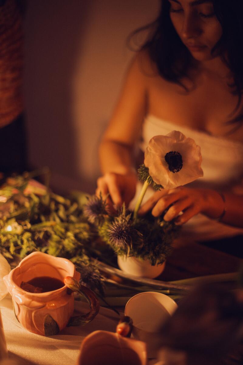 Floral arranging is the main activity.