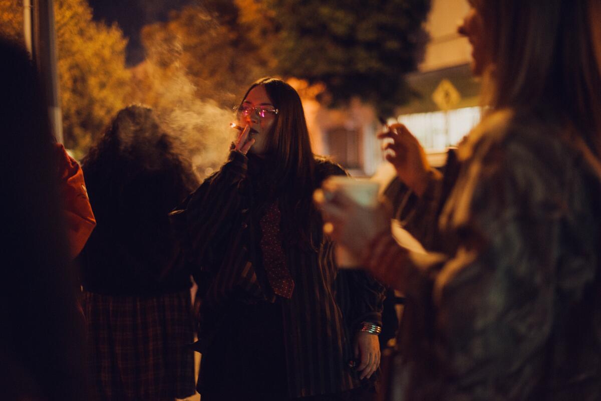 Hand-rolled cannabis joints wrapped in rose petals are presented on a silver platter at The ArtClub (top, right). The Flower Hour aims to reclaim the healing rituals of cannabis and flowers.
