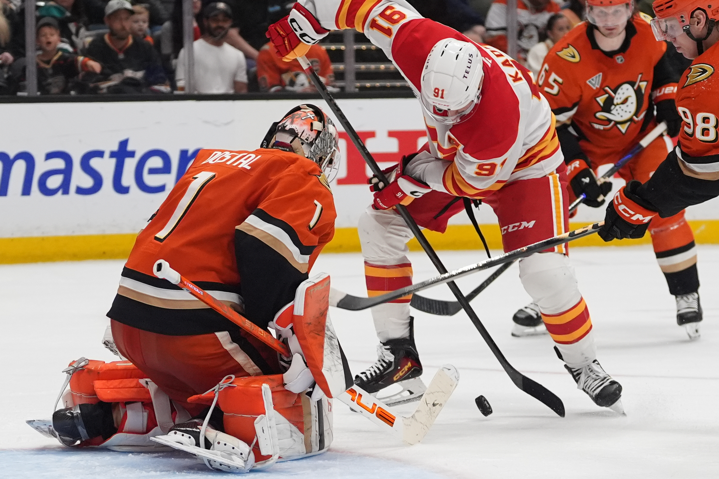 Calgary Flames center Nazem Kadri tries to shoot as Ducks...