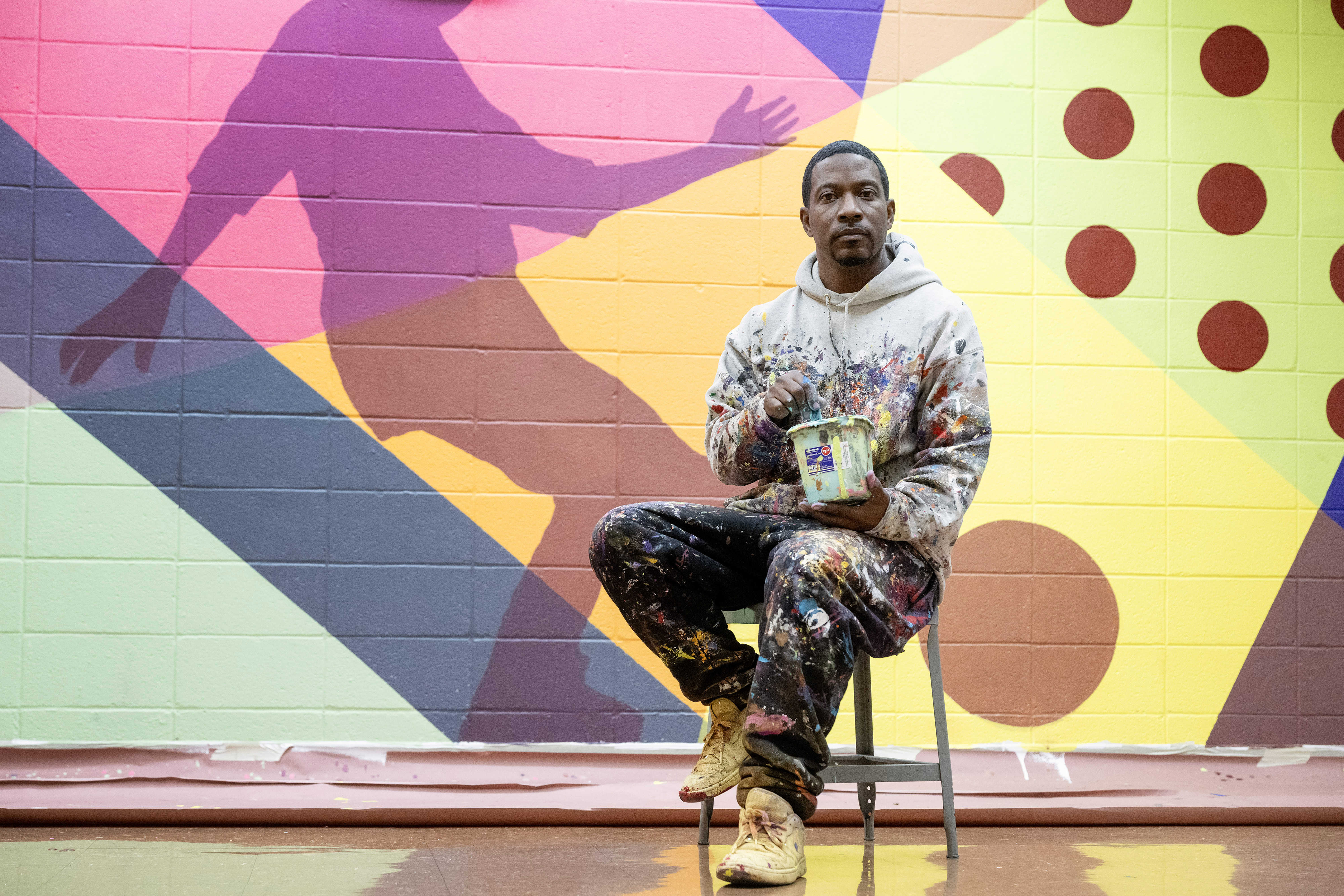 Muralist Mike Norice poses for a portrait at Audubon Middle...