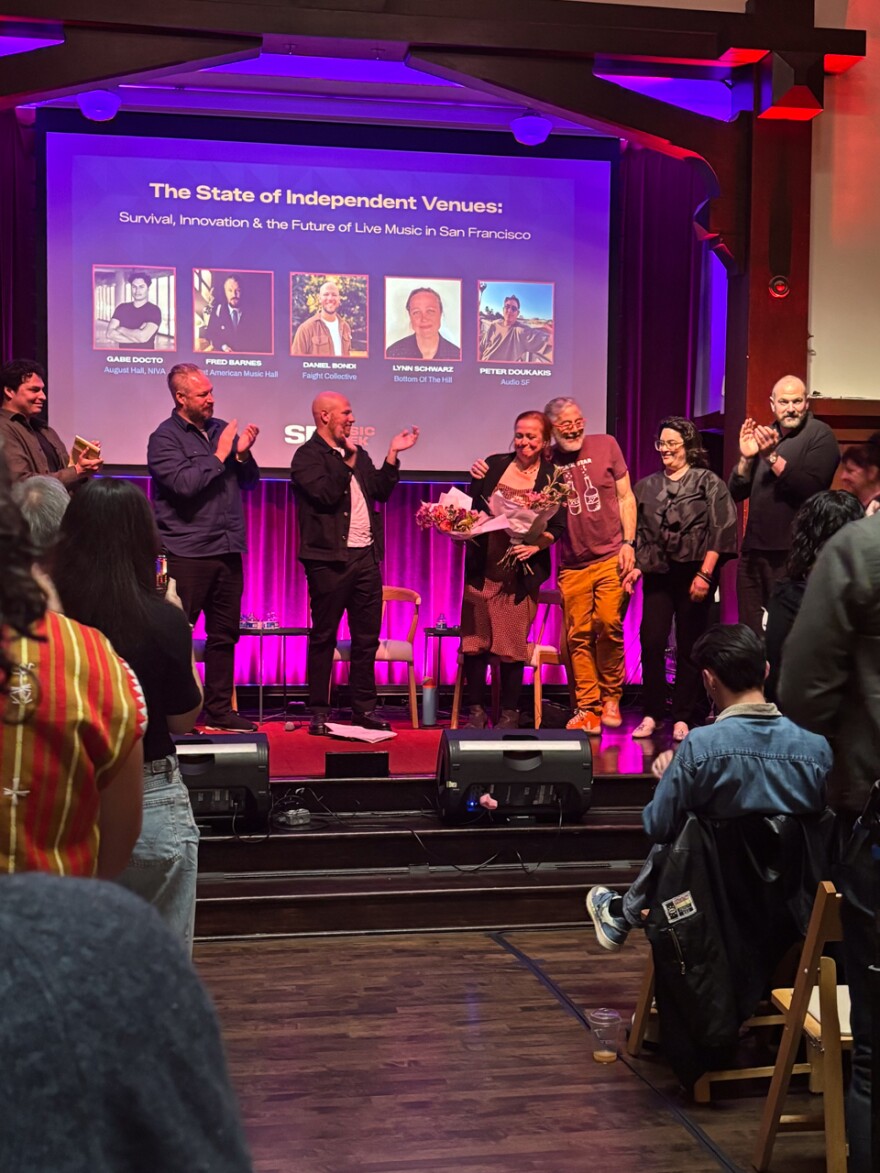 Bottom of the Hill’s Lynn Schwarz receiving her flowers—literally and metaphorically—after speaking on a panel about the state independent venues at SF Music Week's Industry Summit.