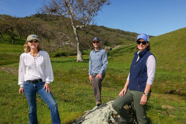 Media and communications senior manager Marti Tedesco, left, president Gordon Clark, and senior transactions project manager Fiona Martin of the Peninsula Open Space Trust, a nonprofit environmental group based in Palo Alto, look on at a Mead Ranch in Morgan Hill, Calif., on Friday, Feb. 27, 2026. The 1,921-acre property, located between San Jose and Morgan Hill and formerly owned by members of the Bechtel family, was sold to the nonprofit for $24.3 million. (Ray Chavez/Bay Area News Group)