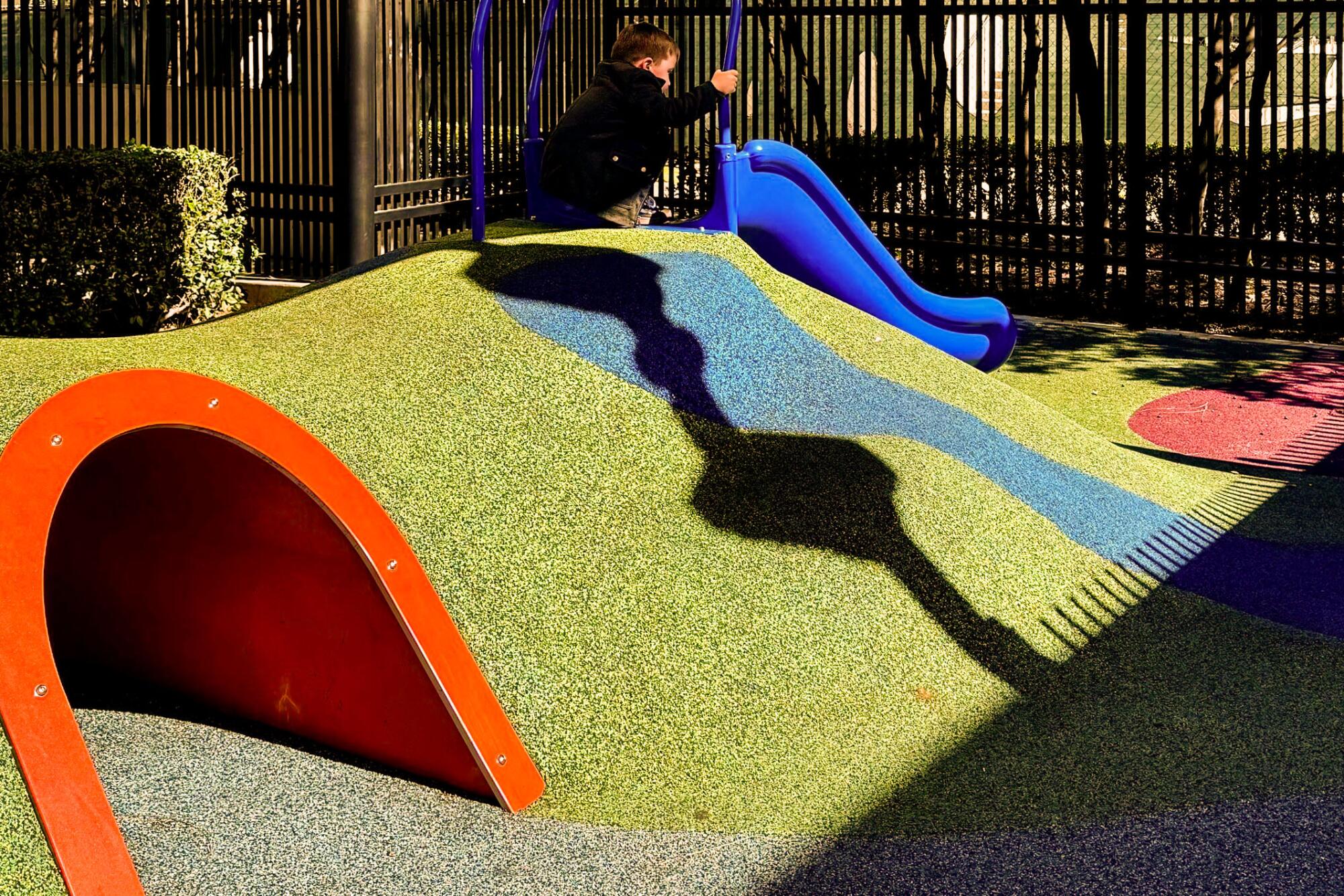A child plays at the playground at Victoria Gardens in Rancho Cucamonga.