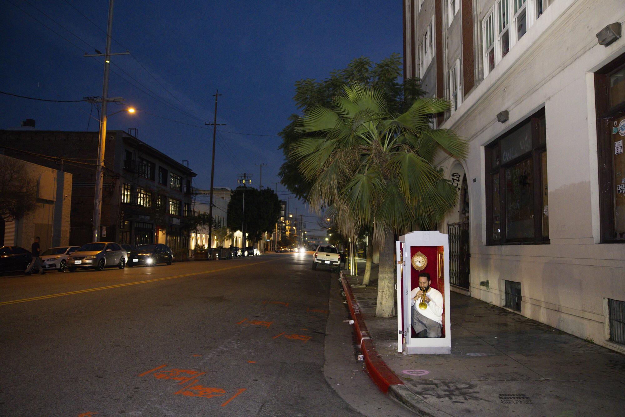 Ethan Marks inside S.C. Mero's theater inside a fake electrical box. The guerrilla art piece is near the American Hotel.