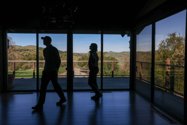 President Gordon Clark, left, and senior transactions project manager Fiona Martin, of the Peninsula Open Space Trust, a nonprofit environmental group based in Palo Alto, walk through Mead Ranch in Morgan Hill, Calif., on Friday, Feb. 27, 2026. The 1,921-acre property, located between San Jose and Morgan Hill and formerly owned by members of the Bechtel family, was sold to the nonprofit for $24.3 million. (Ray Chavez/Bay Area News Group)