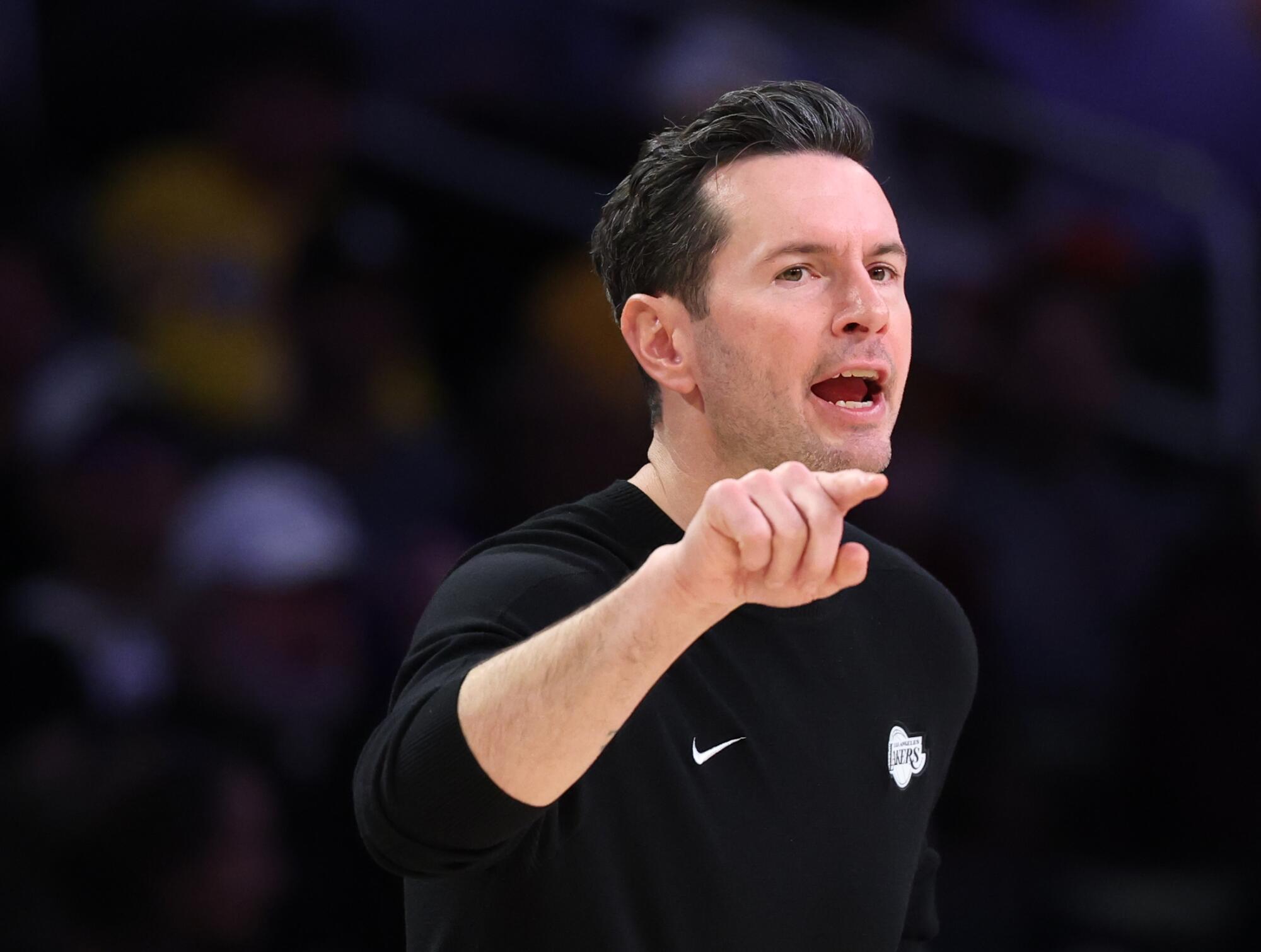 Lakers coach JJ Redick directs his team during a win over the Pelicans at Crypto.com Arena on Tuesday.