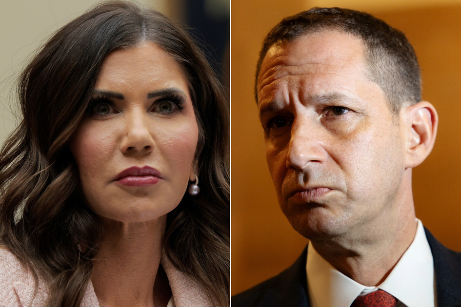 A woman with long dark hair and pearl earrings looks attentive, while a man with short dark hair and a serious expression wears a suit and tie.