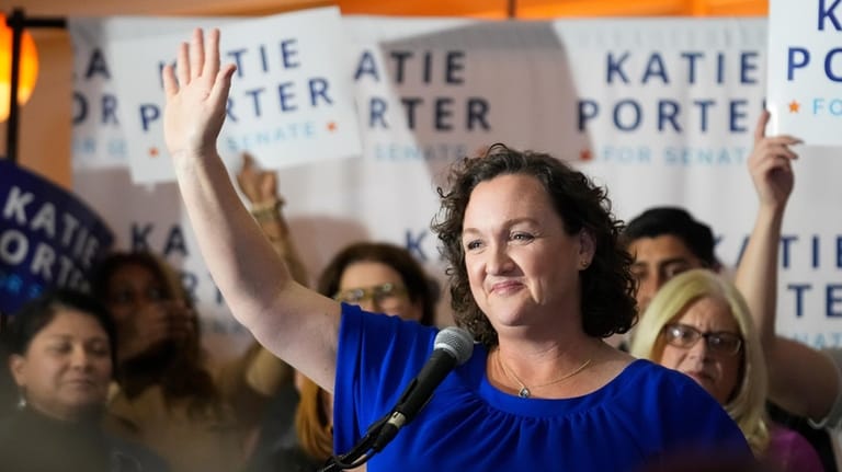 U.S. Rep. Katie Porter, D-Calif., waves at supporters at an...