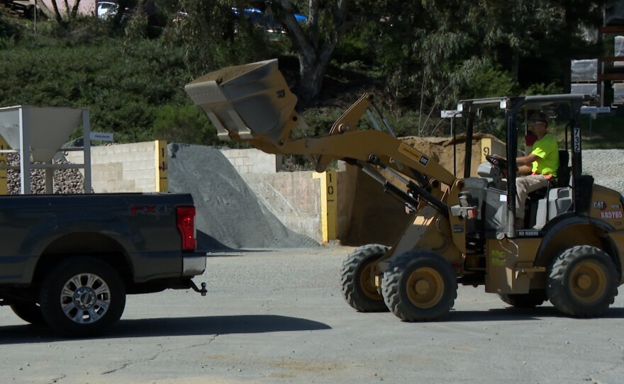 A skip loader is shown loading material into a truck at RCP Block & Brick in Lemon Grove on March 5, 2026.
