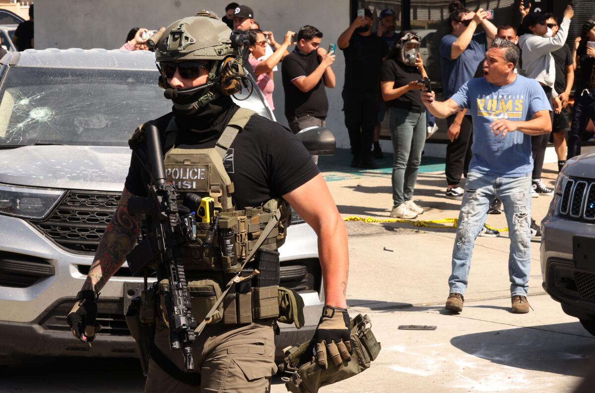 Residents confront ICE agents