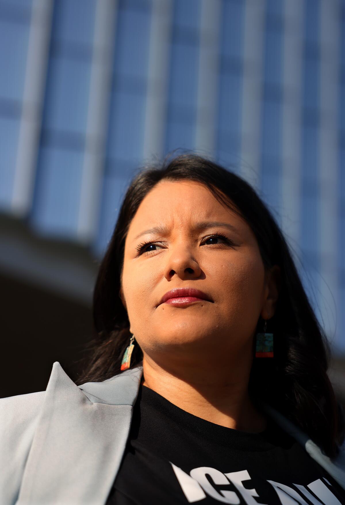 A woman in front of a building