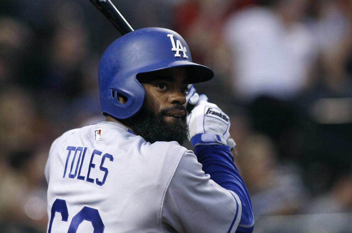 Andrew Toles bats for the Dodgers during a game in April 2017.