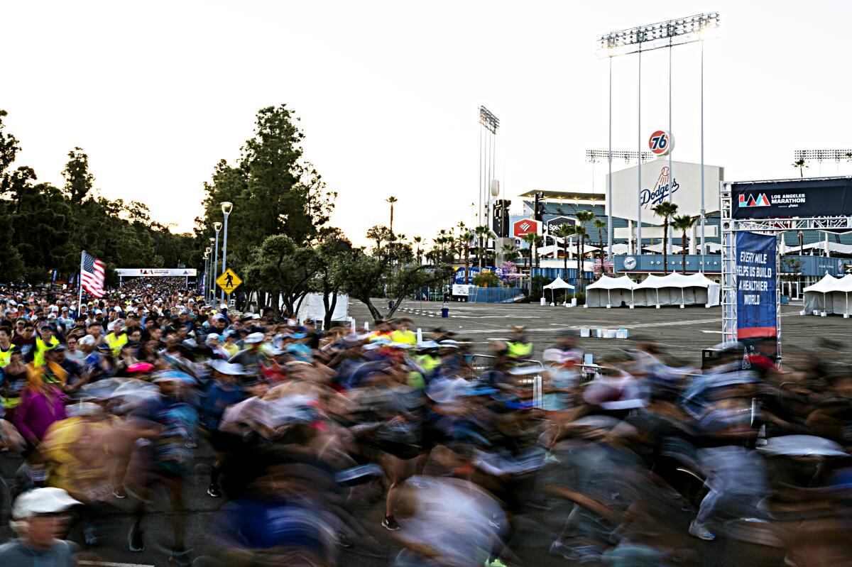 Runners take off from Dodger Stadium during the 37th annual Los Angeles Marathon.