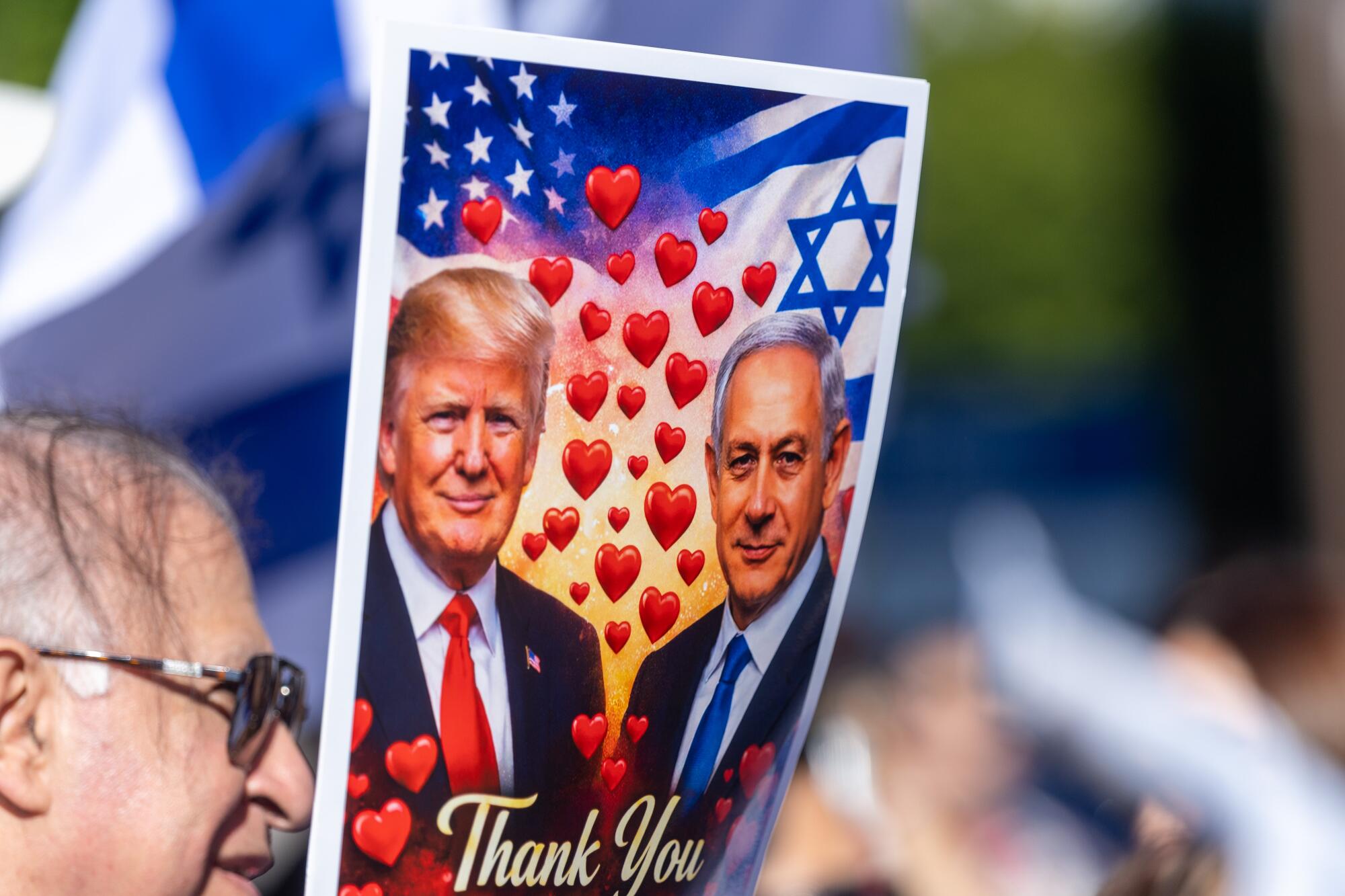 An sign depicting President Trump and Israeli President Benjamin Netanyahu.