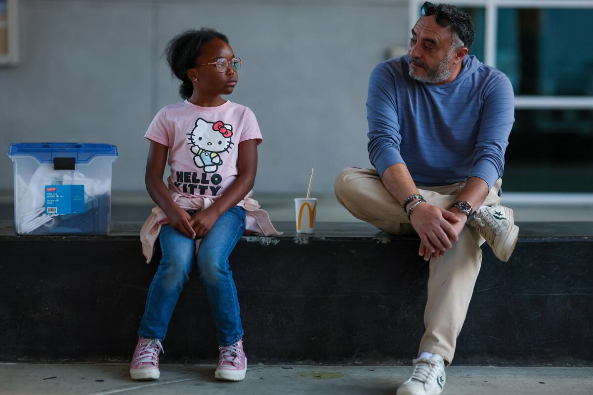 Honey Cooper chats with Professor Nader Gergis before attending his class on Wednesday.