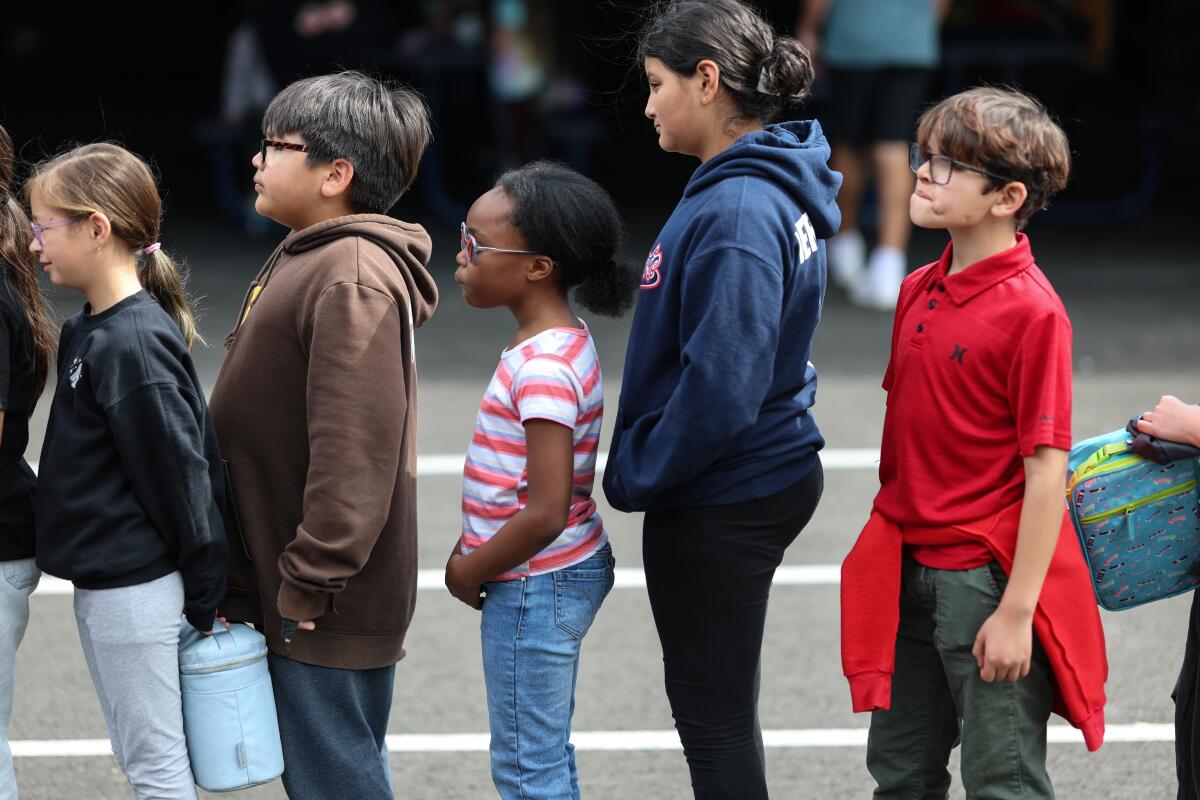 Honey Cooper lines up with classmates for lunch at Kimbark Elementary