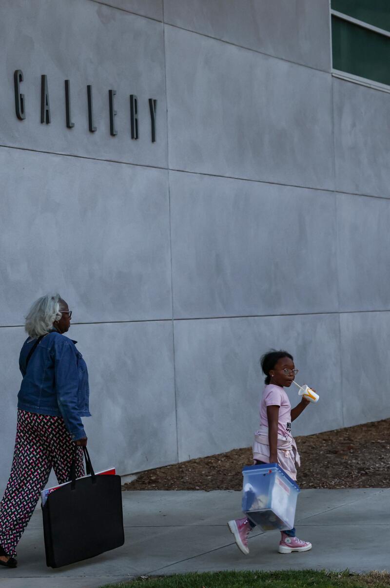 Honey Cooper is escorted by her grandmother, Pretty Jackson, to her art class at San Bernardino Valley College.