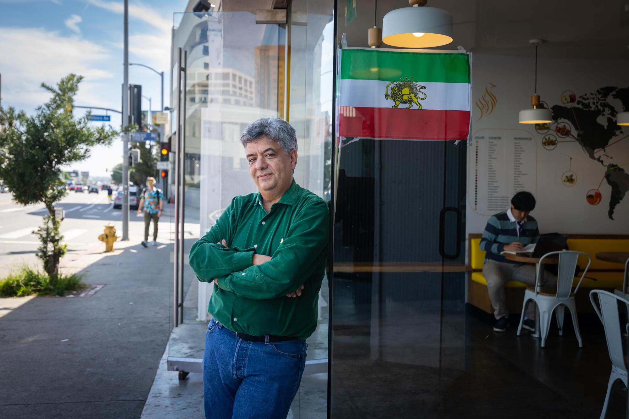 Roozbeh Farahanipour ,owner of Delphi Greek restaurant in Westwood, stands for a portrait