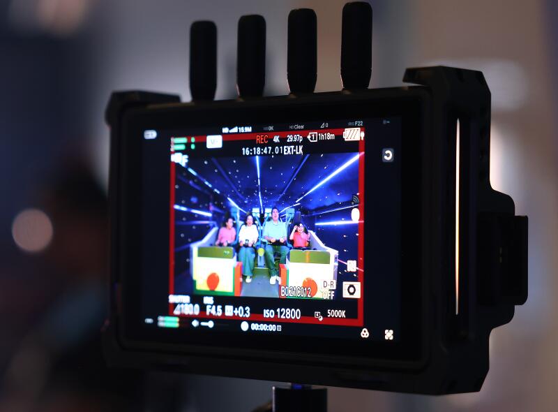 L.A. residents Veronica and Eloy Navarro with their children Zoe, 10, left, and Levi, 9, right, ride the Galacticoaster.