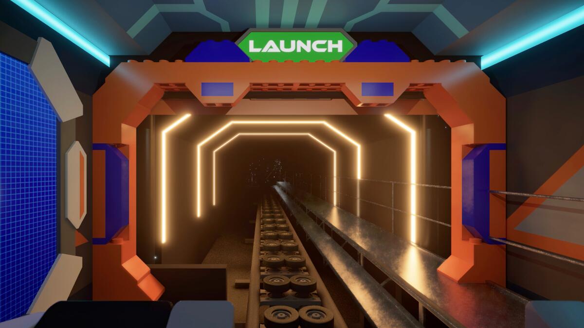 A roller coaster track framed by white lights.