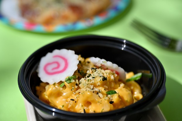 Ramen Mac & Cheese; Furikake crumble, fish cakes, green onions and chile crunch at the Peppers Cali-Ente festival marketplace food booth during the California Food & Wine Festival inside California Adventure running March 6 through April 27, 2026. Photographed on Friday, March 6, 2026. (Photo by Jeff Gritchen, Orange County Register/SCNG)