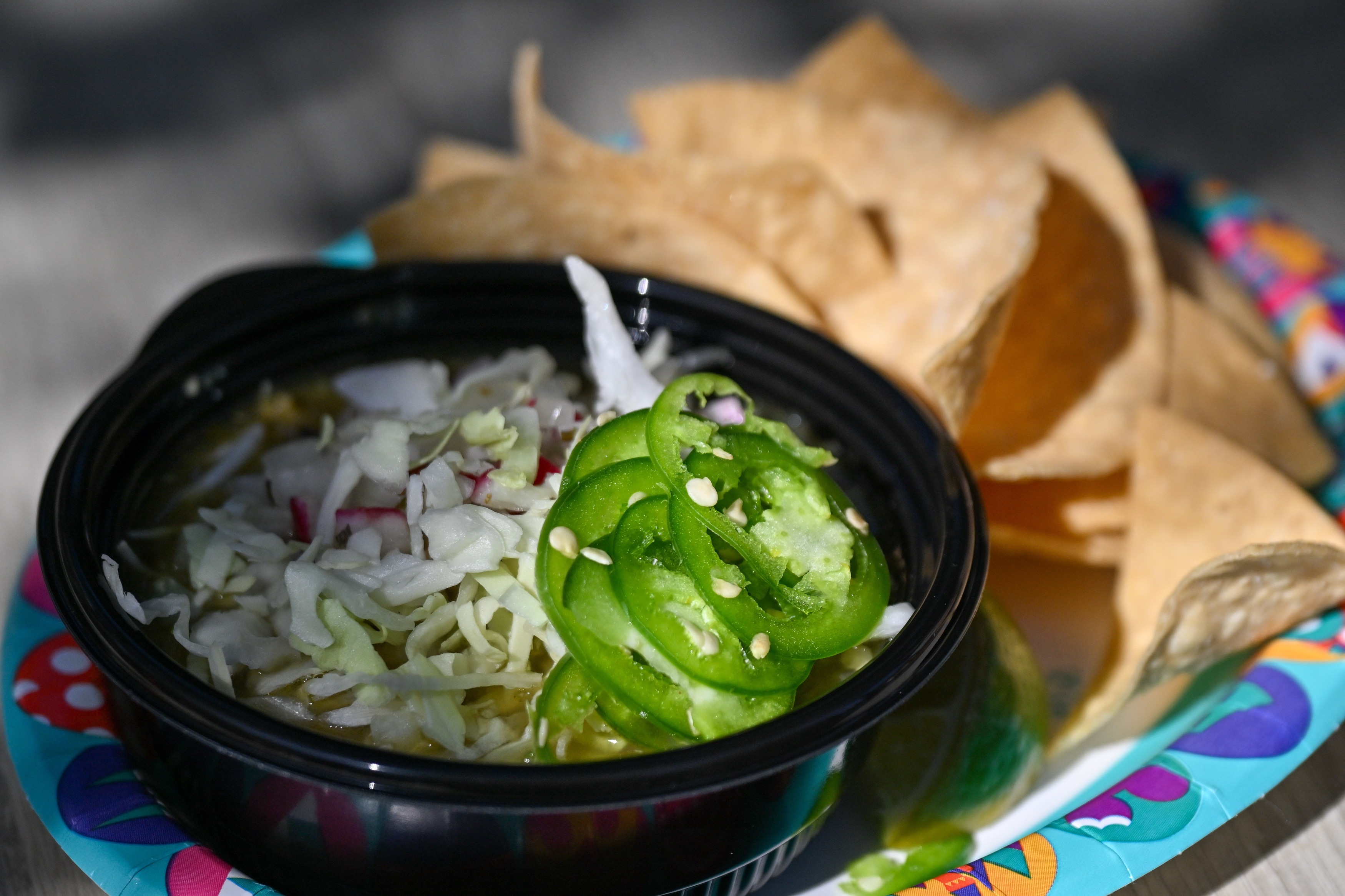 Green Pozole; traditional Mexican stew with chicken and hominy served...
